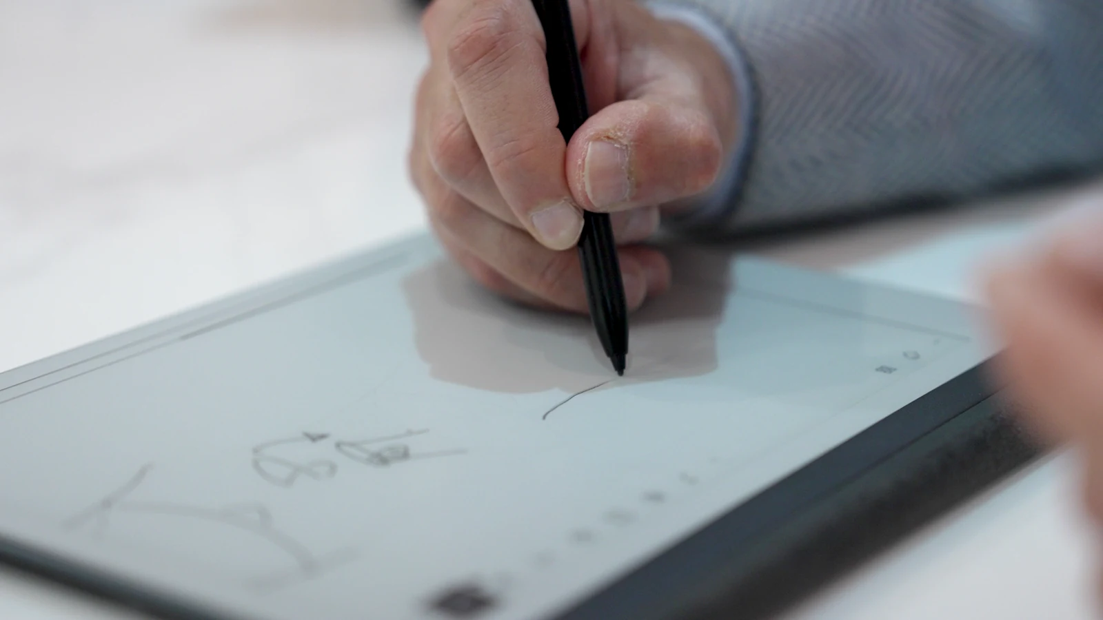 Consultant illustrating treatment options on a digital tablet